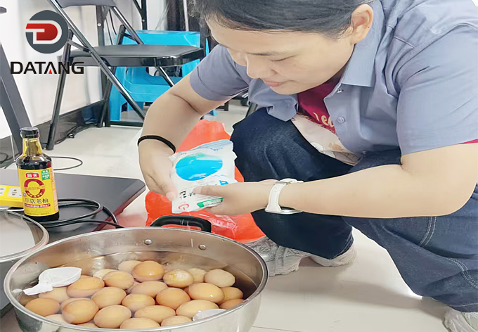Fragrant Chinese tea eggs simmering in the pot during the festive celebration at Datang Finned Tube factory kitchen
