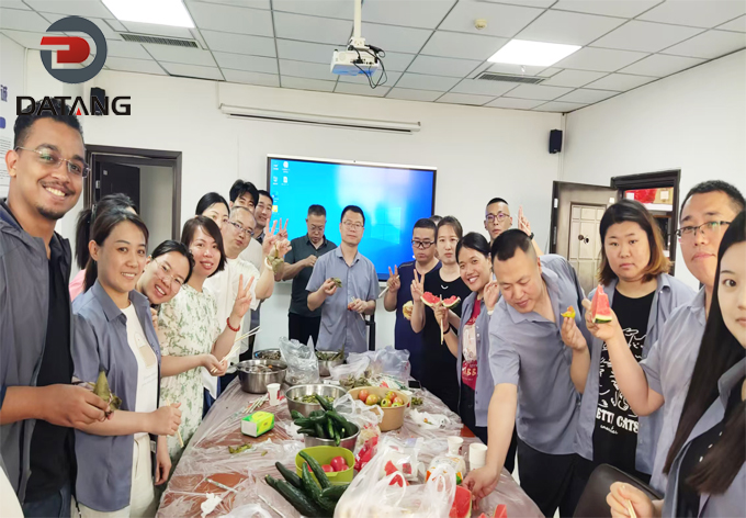 The cohesive and warm team of Datang Finned Tube enjoying a hearty festive dinner together, reflecting our family company culture
